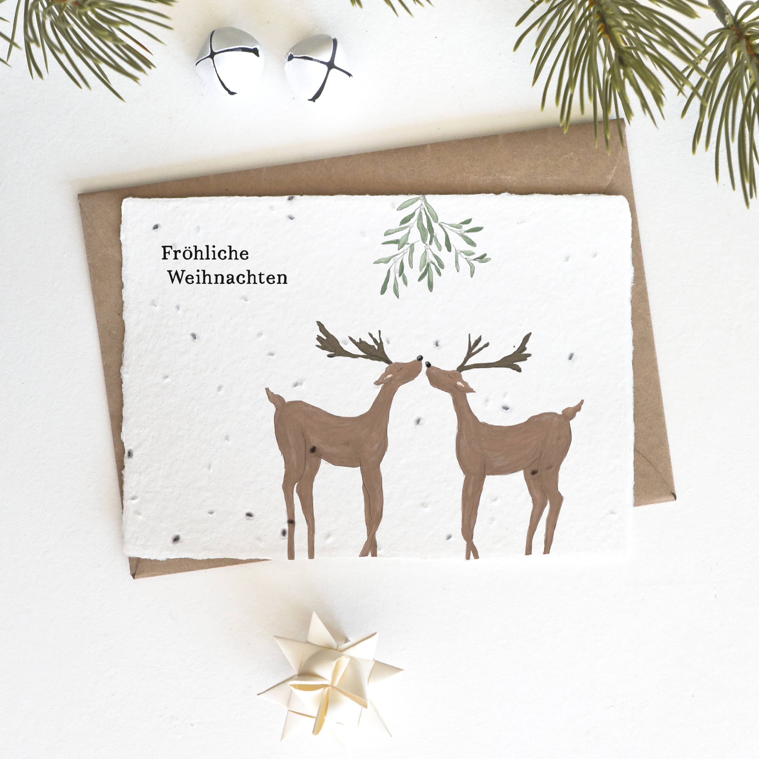 heylittlegreen-handgeschöpftes-Saatpapier-Weihnachtskarte-Rentiere-unter-Mistelzweig